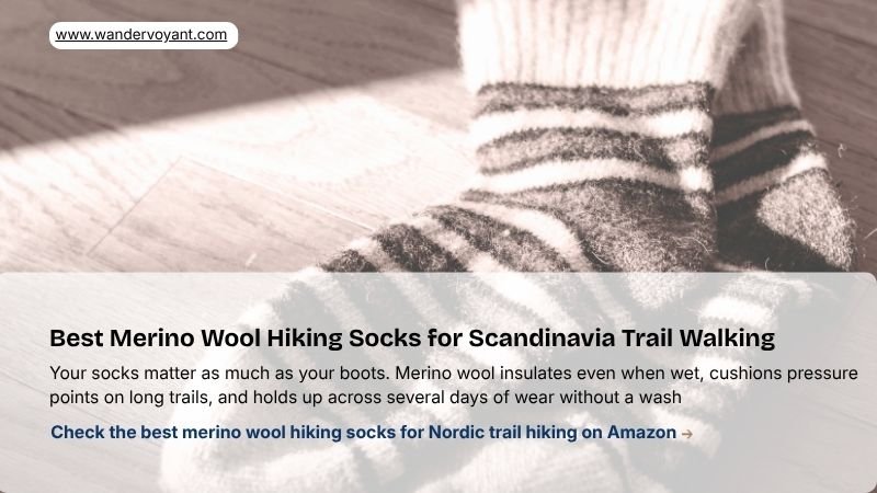 Thick merino wool hiking socks beside trail boots best socks for Scandinavia hiking and Nordic cold weather t