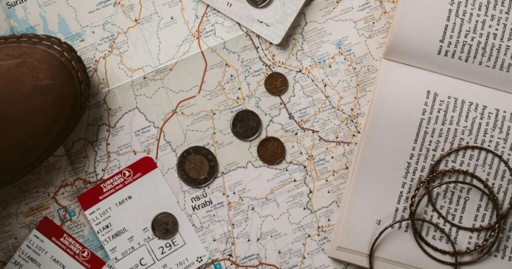 A first time solo traveler reviewing a map and travel documents at a cafe before their trip