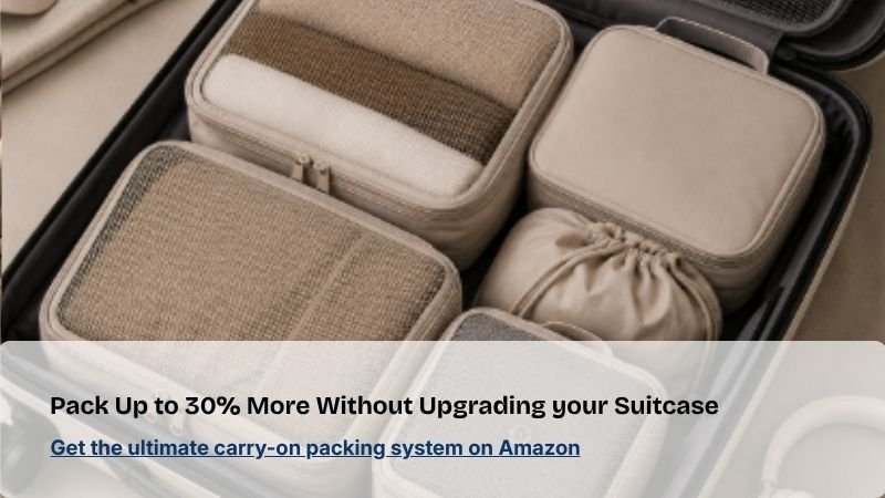Carry-on suitcase packed with compression packing cubes and travel organizers for efficient, space-saving travel packing.*